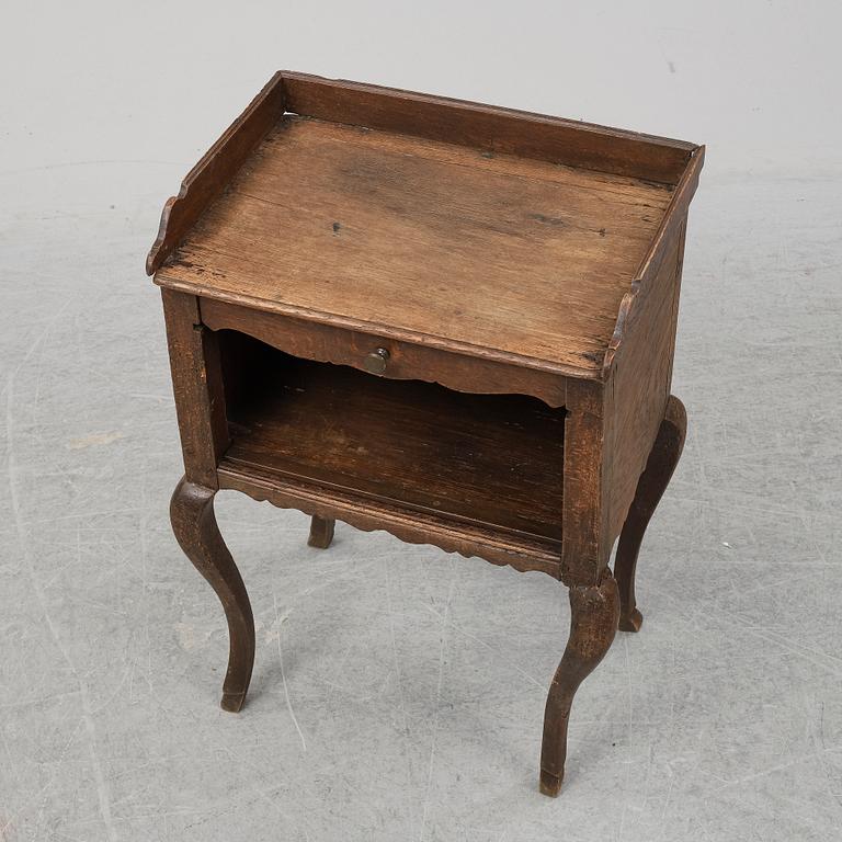 A mid 18th Century oak rococo bedside table.