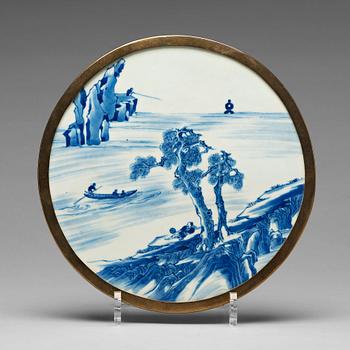 920. A blue and white porcelain placque, 18th Century.