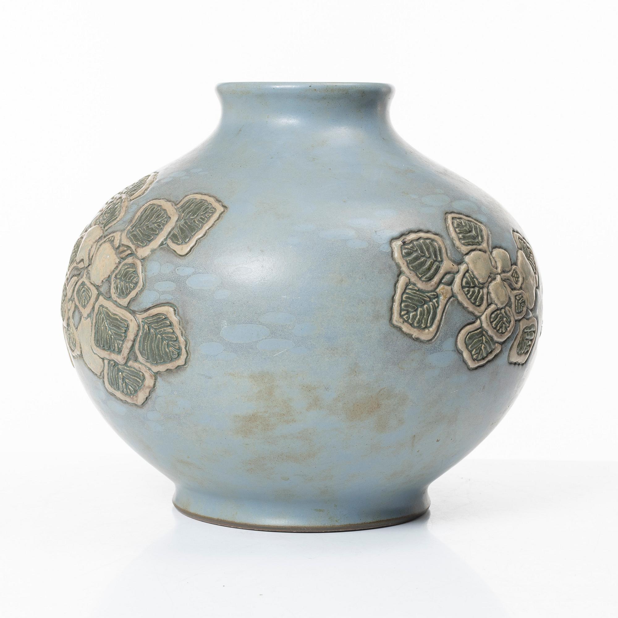 A blue glazed relief vase, possibly Korea, around 1900.