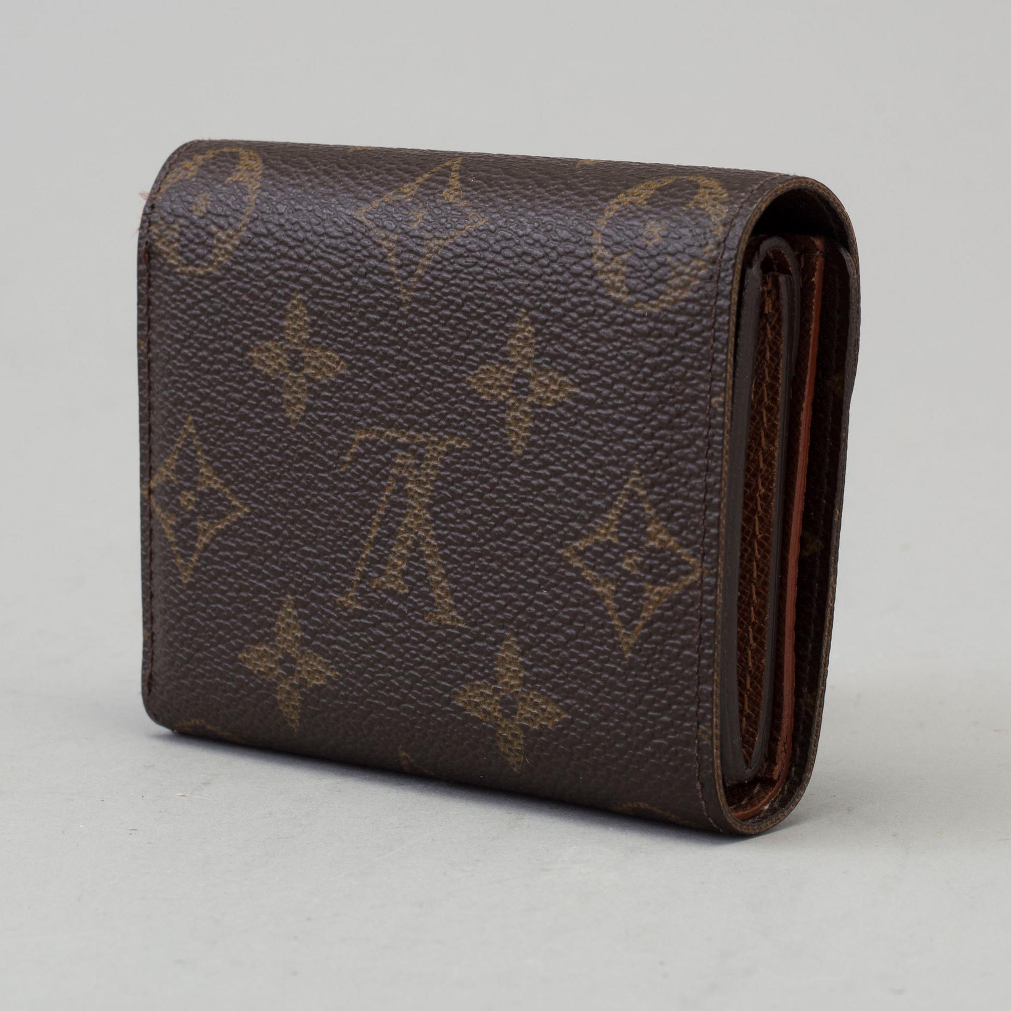 a LOUIS VUITTON 'Helene' wallet.