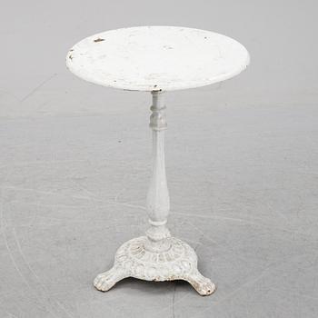 A cast iron garden table, early 20th century.