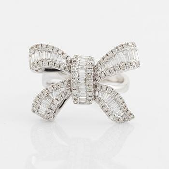 Baguette- and brilliant cut diamond bow ring.