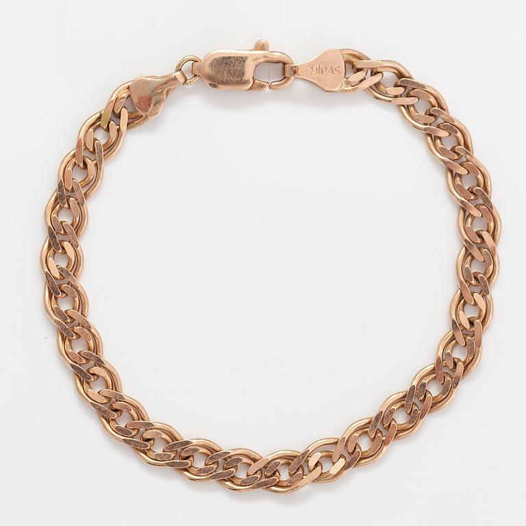 A 14K gold bracelet. Marked Midas.