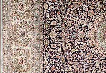 An oriental silk carpet, c. 297 x 202 cm.