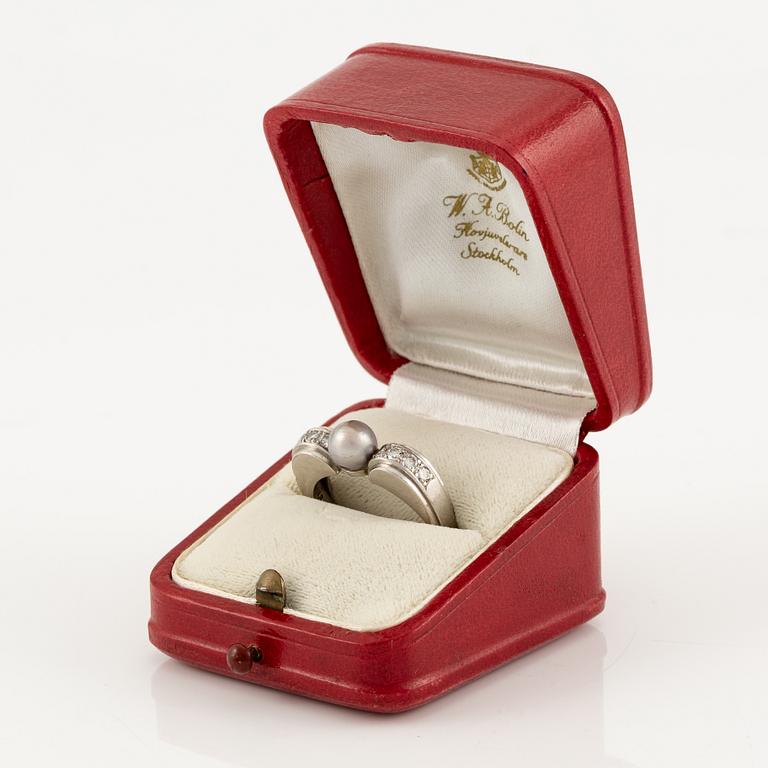 A W.A. Bolin ring in platinum with a pearl and round brilliant-cut diamonds.