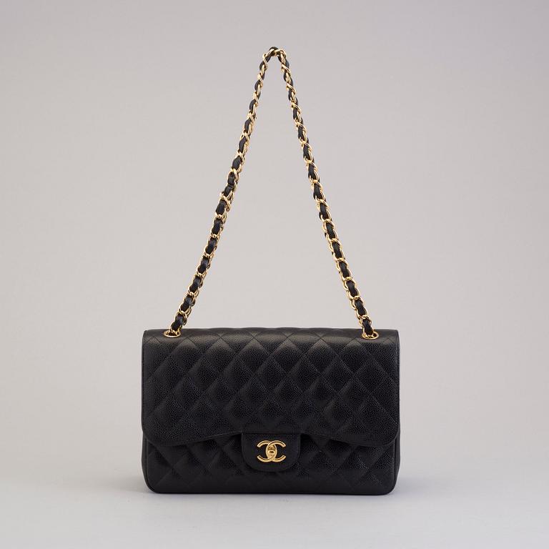 A "Double flap bag maxi" by Chanel 2015-16.