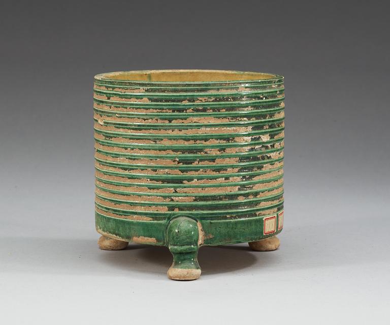 A green and yellow glazed tripod censer, Tang dynasty (618-907).