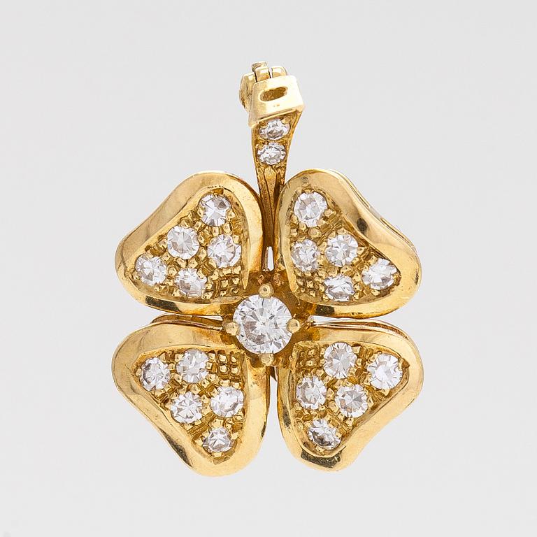 An 18K gold and diamond four-leaf clover brooch/pendant.