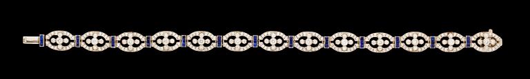 A gold diamond and sapphire bracelet.
