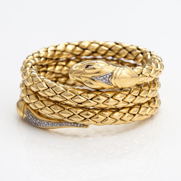 Chimento, An 18K gold snake bracelet with rubies and diamonds ca. 0.46 t in total. Italy.