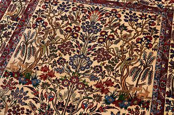 A semi-antique Qum carpet, Central Persia, c. 312 x 215 cm.