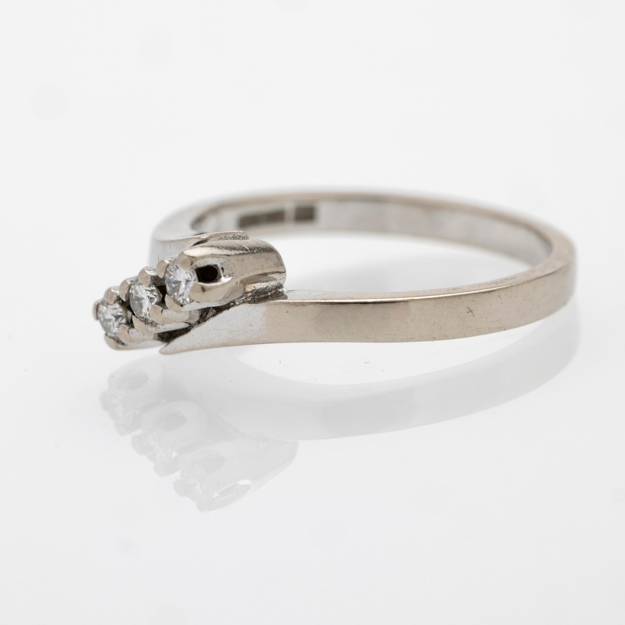 18K white gold ring with diamonds.
