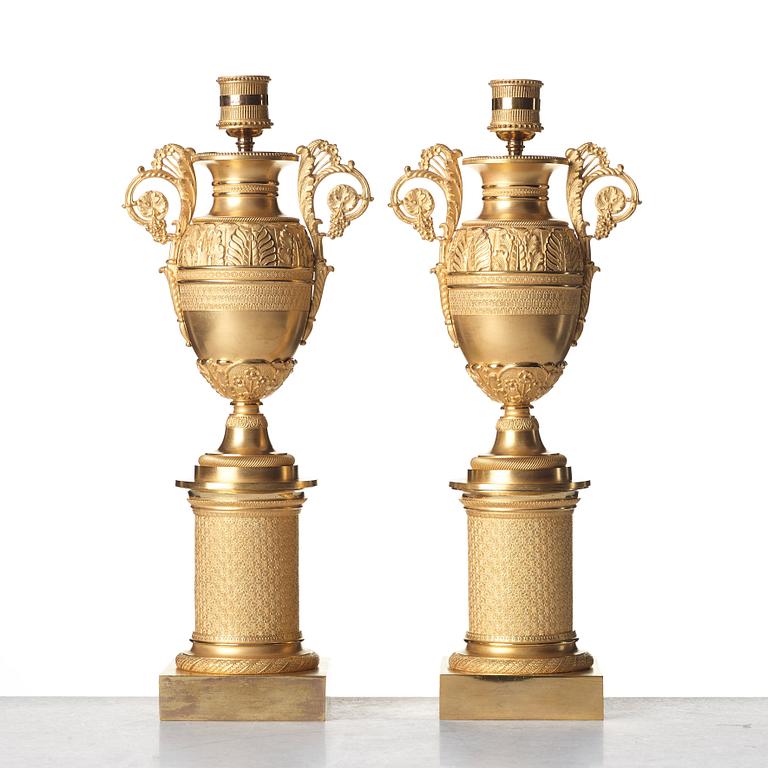 A pair of French Empire candlesticks, early 19th century.