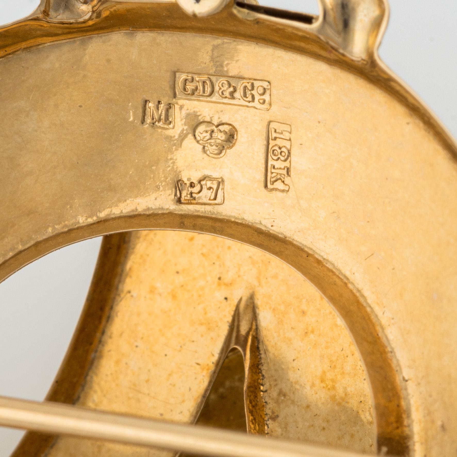 Brosch 18K guld med en pärla.