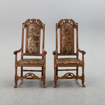 A first half of the 18th century pair of baroque oak armchairs.