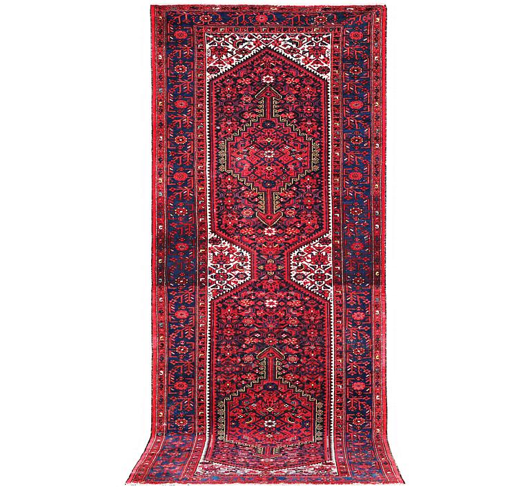 A Hosseinabad carpet, c. 391 x 135 cm.