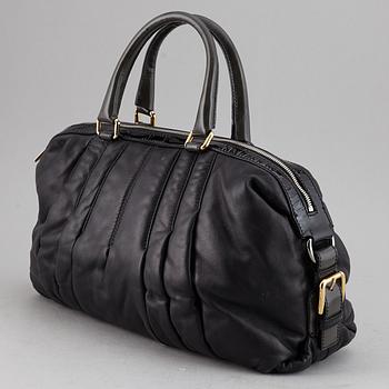DOLCE & GABBANA, a black leather bag.