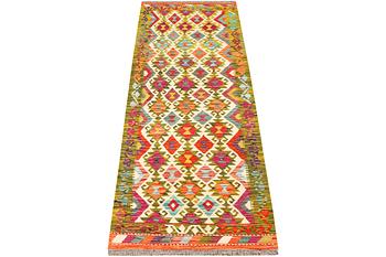 An Afghan kilim rug, c. 246 x 80 cm.