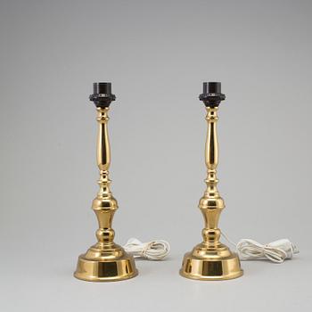 A pair of mid 29th century brass table lamps.