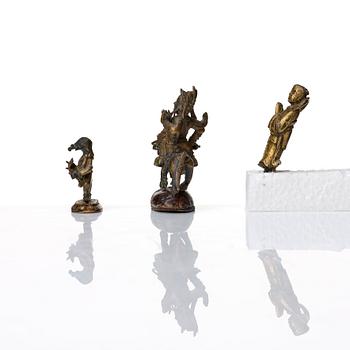 A group of three bronze miniatures sculptures of deities, China and Tibet, 18th Century.