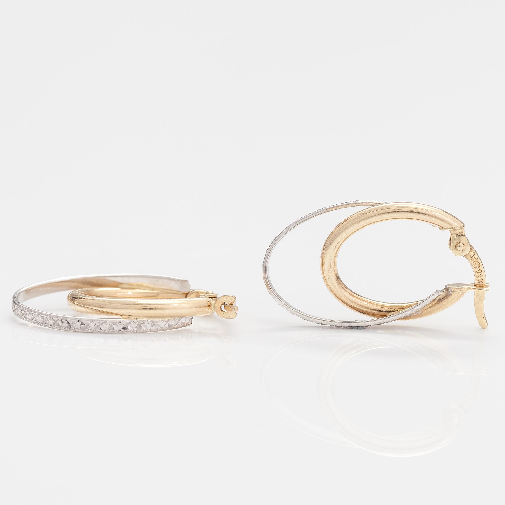 A pair of 14K gold earrings.