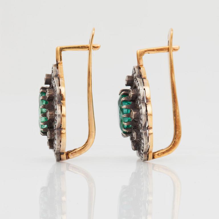 A pair of earrings with diamonds and emeralds. Russian setting.