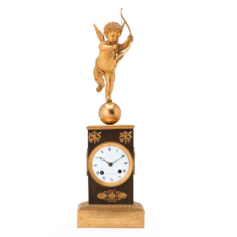 A Swedish Empire gilt and patinated bronze mantel clock by J F Cedergren, clockmaker in Stockholm 1811-1839.