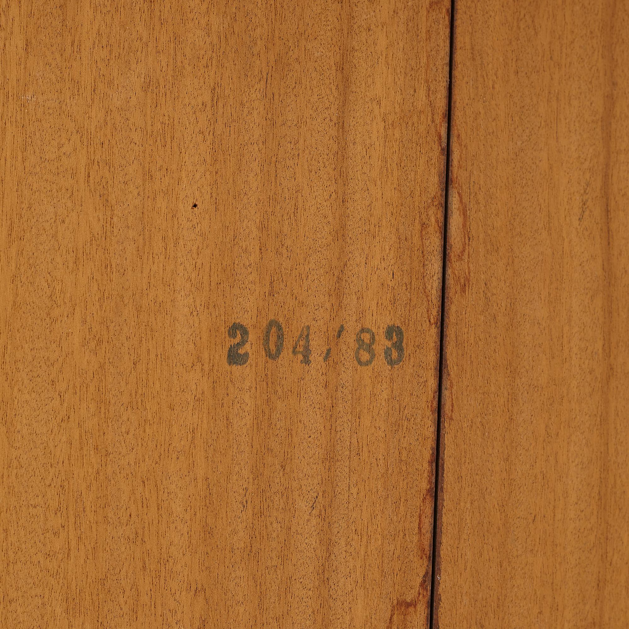 Niles Otto Møller, a rosewood veneered table with four chairs, JL Møller, Denmark, 1950's/60's.