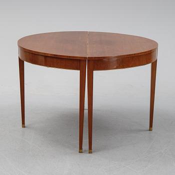 A late Gustavian style mahogany dining table in two parts, ca 1900.