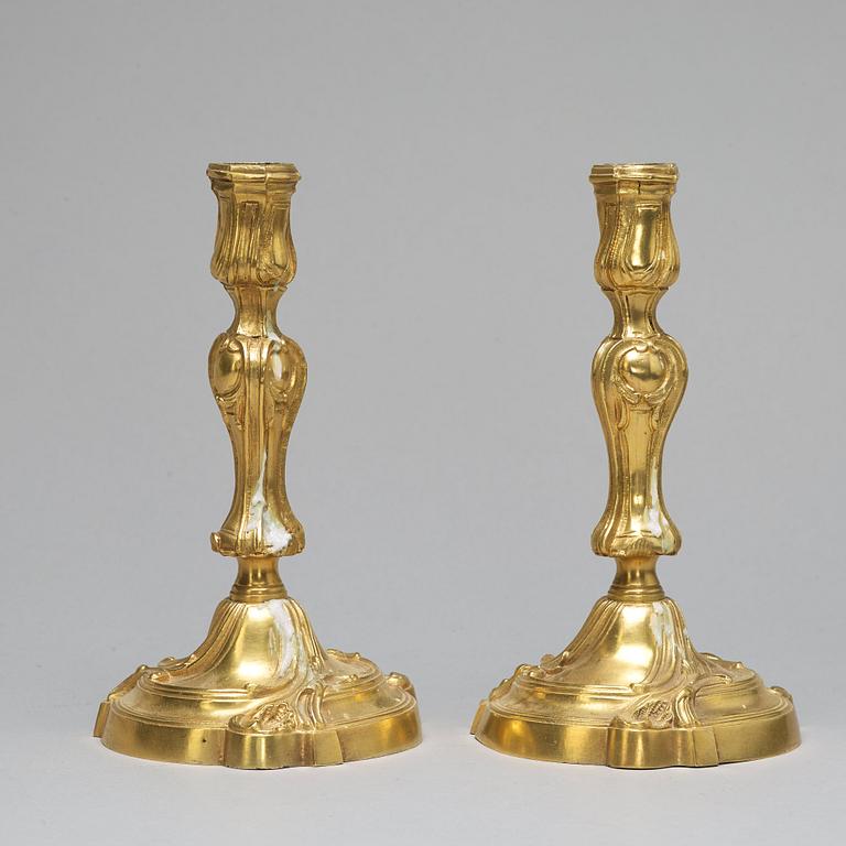 A pair of Louis XV-style candlesticks, circa 1900.