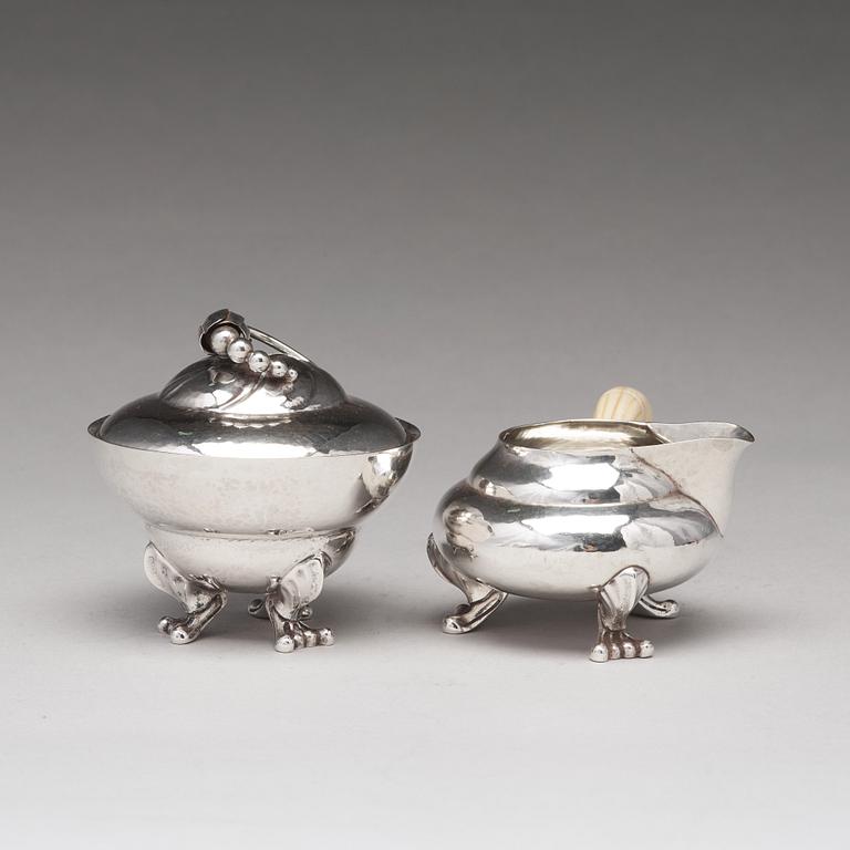 Georg Jensen, a "Blossom" sugarbowl and creamer, Copenhagen 1919-21, 830/1000 silver.