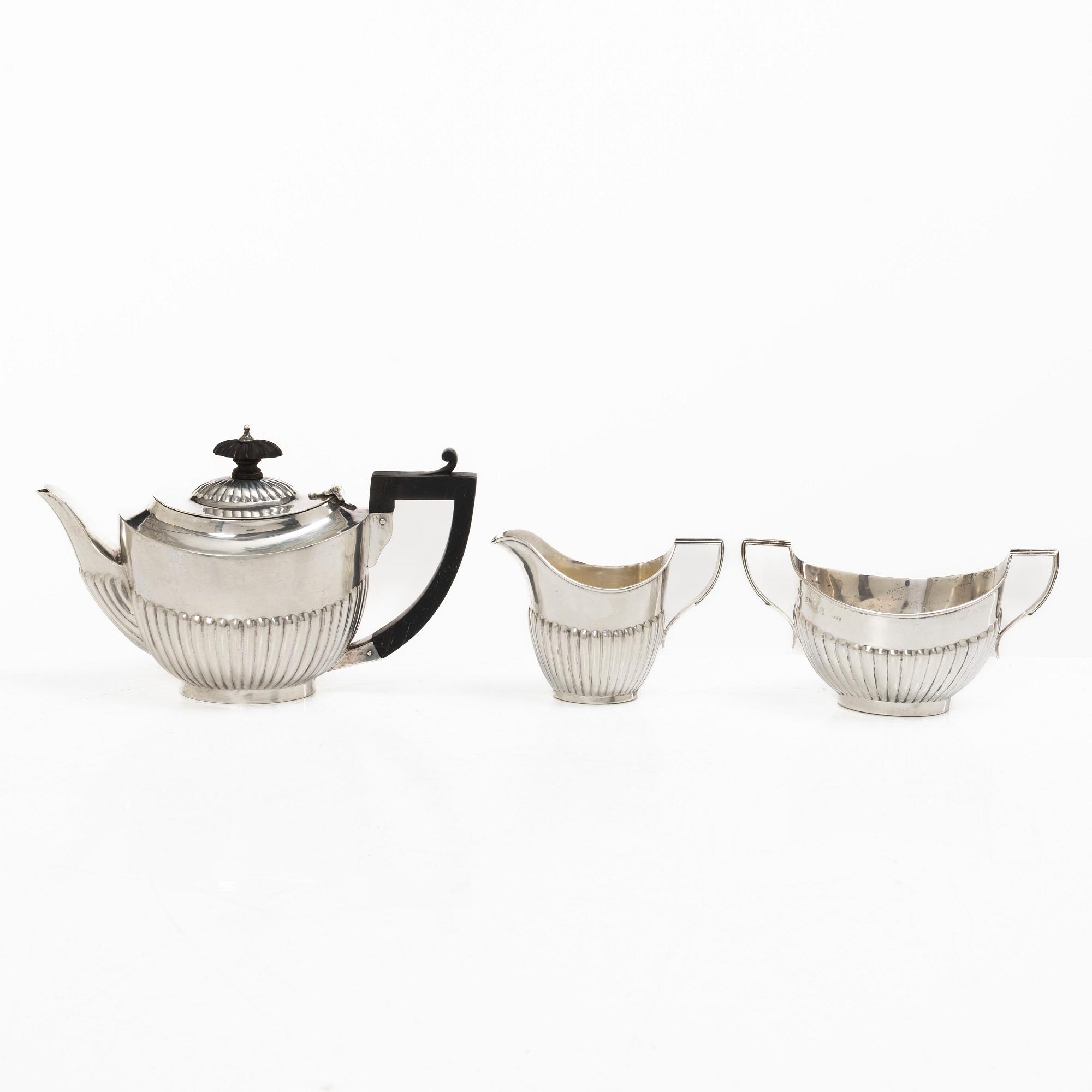 Thomas Hayes, a silver teapot, cream jug and sugar bowl, Birmingham 1897.