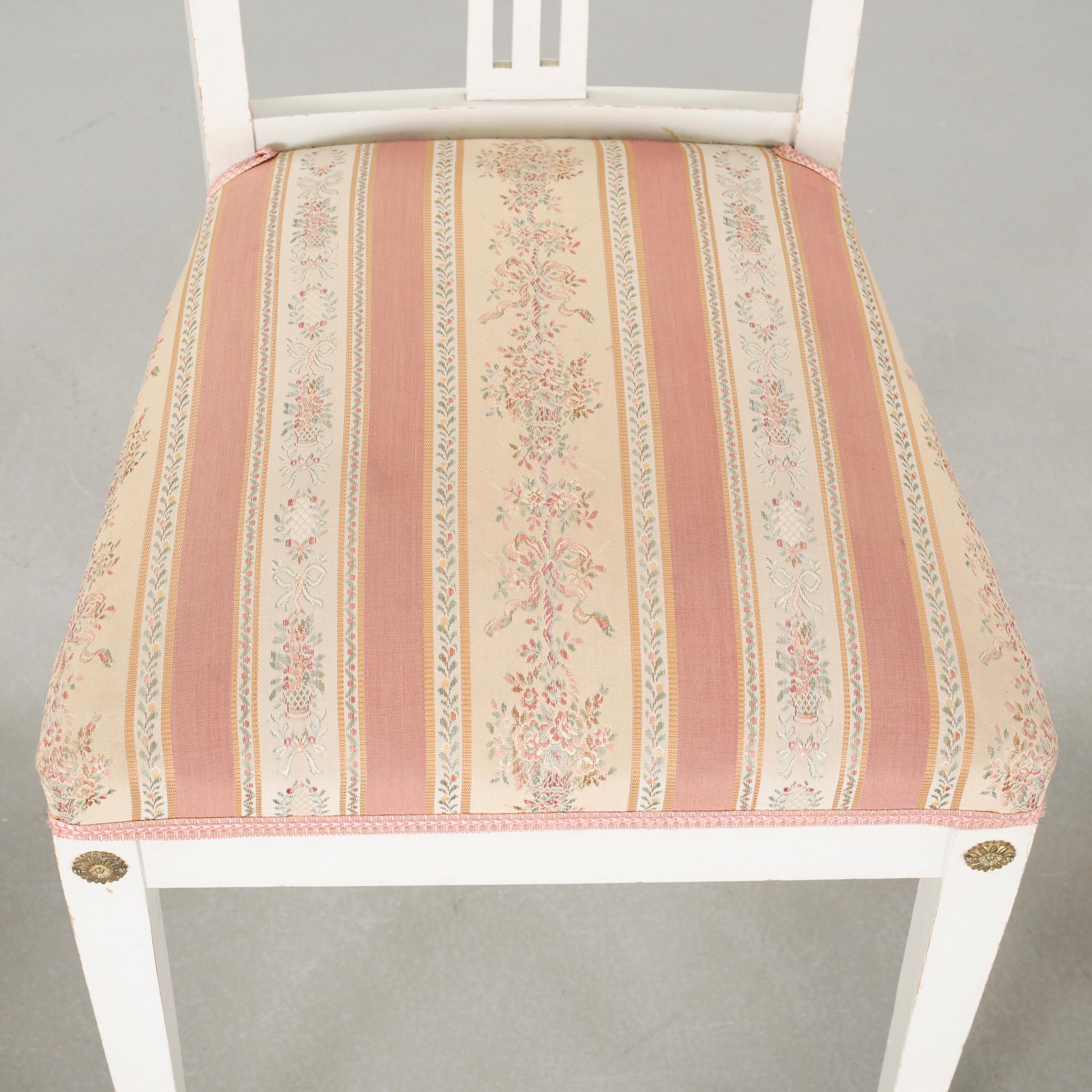 Two gustavian style armchairs and three chairs, first half of the 20th century.