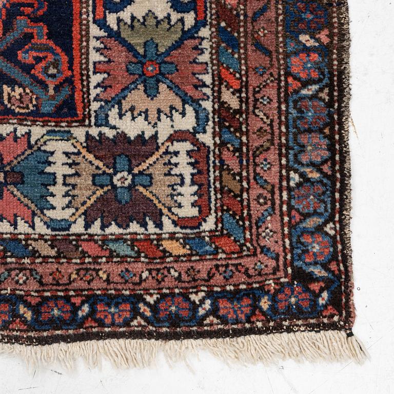 An oriental rug, c. 232 x 125 cm.