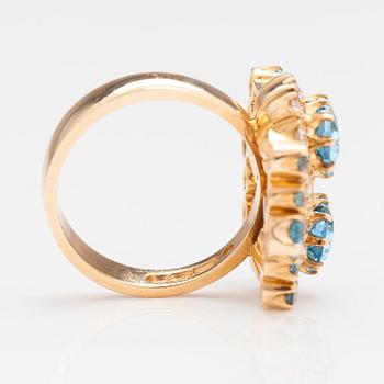 An 18K gold ring "Sophia Albertina" with diamonda ca. 0.54 ct in total and topazes. Ofelia Jewelry, Helsinki 1998.