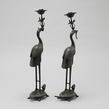 A pair of bronze candlesticks, China, 20th Century.