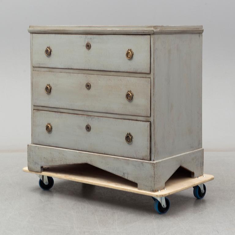 A mid 19th century painted chest of drawers.