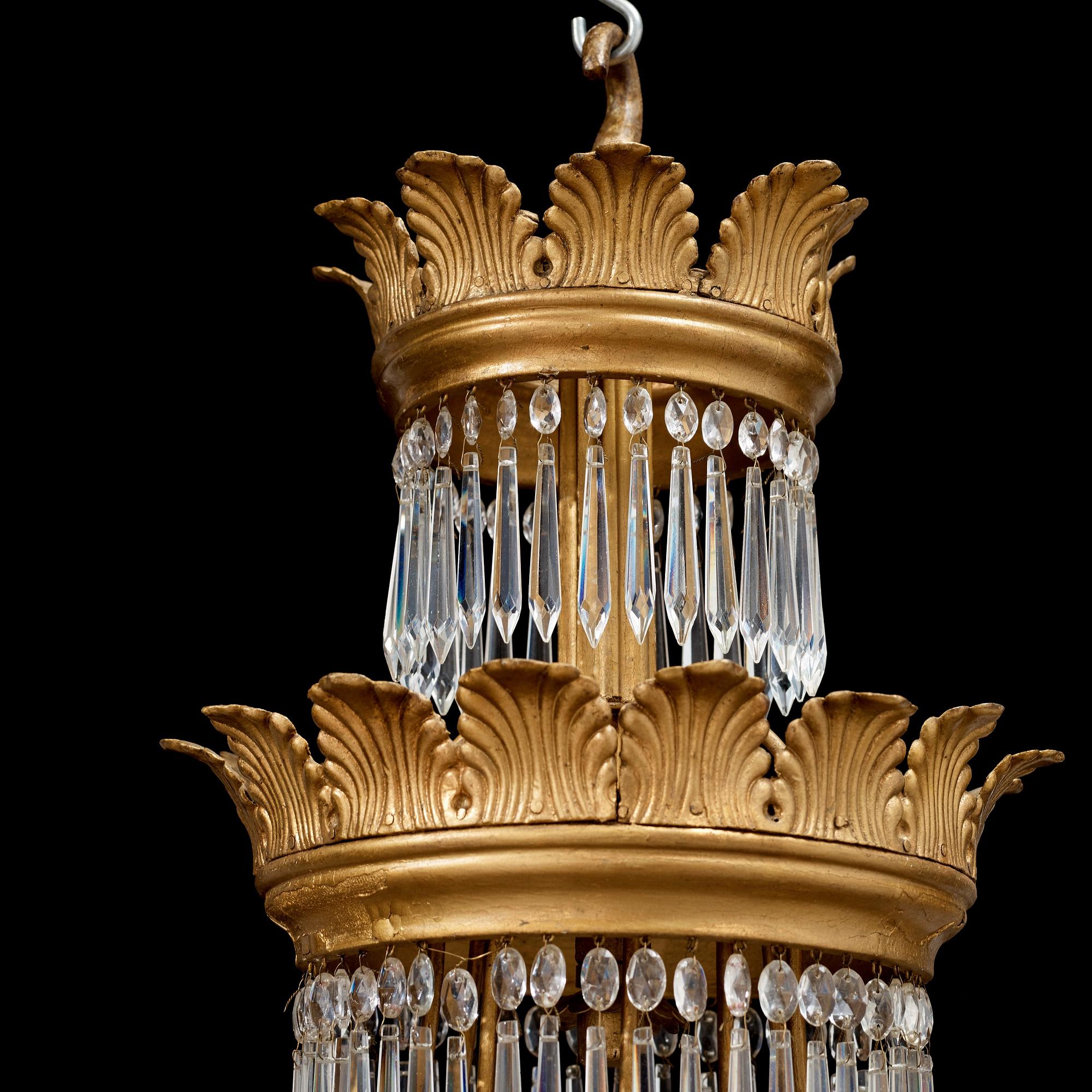 A German 19th century sixteen-light chandelier in the manner of Karl Friedrich Schinkel.