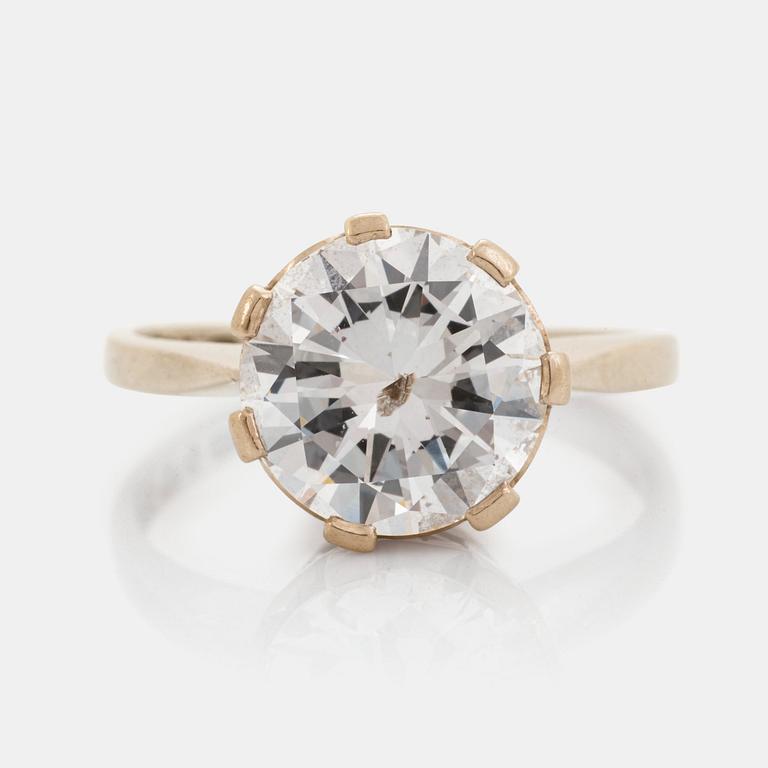 A platinum ring set with a round brilliant-cut diamond ca 2.75 cts quality ca H/I i.