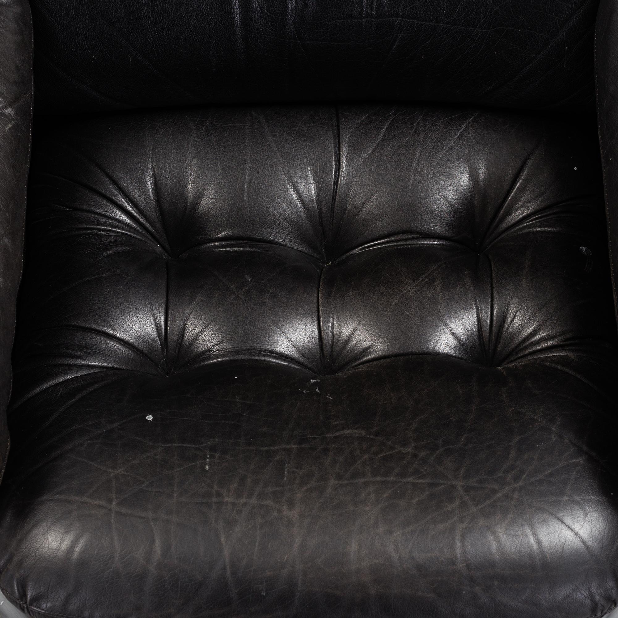 A pair of leather upholstered easy chairs from Dux, late 20th Century.