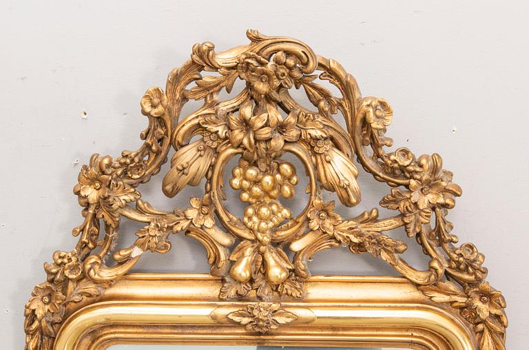 A bronzed Neo Rovovo mirror and table later part of the 19th century.