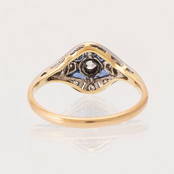 An 18K white and red gold ring set with old-cut diamonds and step-cut blue gemstones, Petterssons Stockholm 1937.