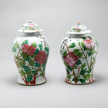 Two similar 20th century porcelain jars with lids.