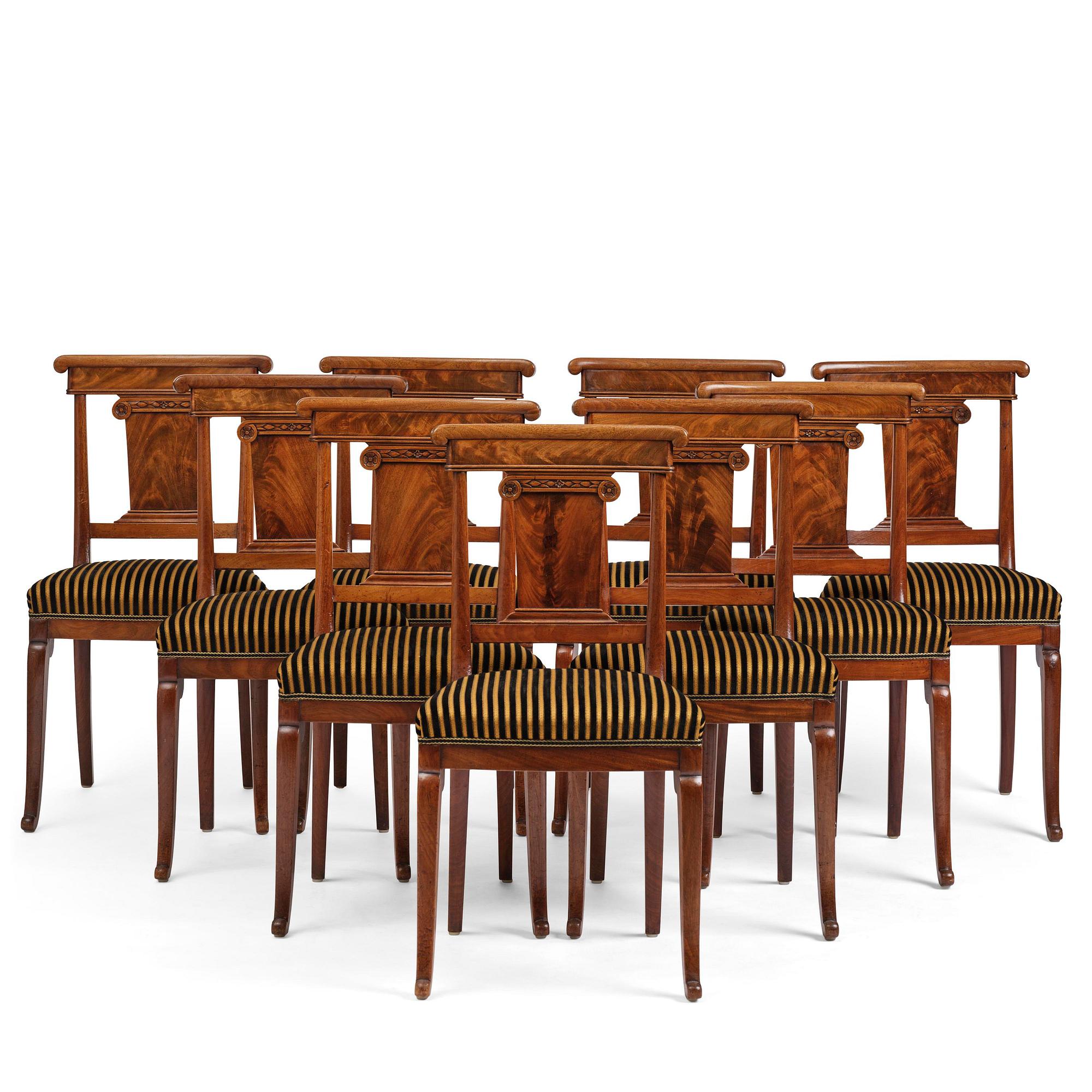 A set of nine Charles X mahogny dining chairs.