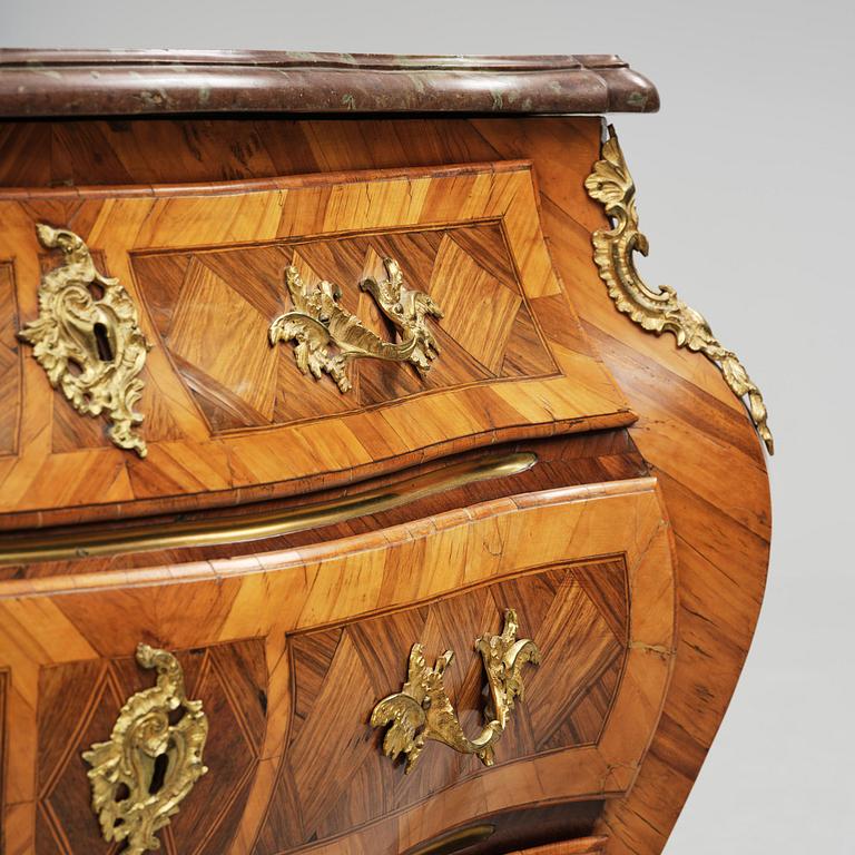 A rococo parquetry and gilt brass-mounted commode attrbuted to M. Engström (master in Stockholm 1758-97).
