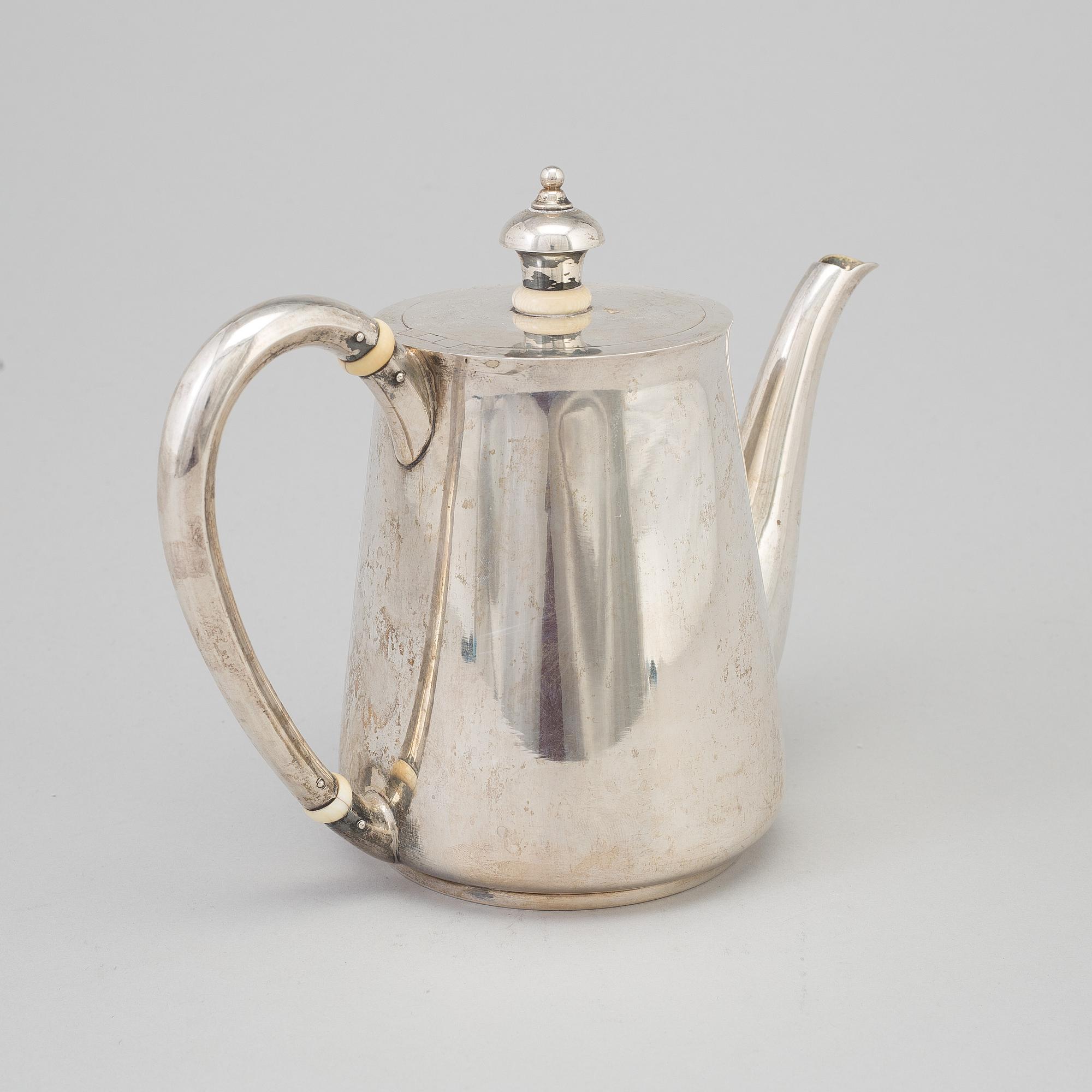 A Russian parcel-gilt teapot, mark of Nicols Karl & Plinke, St Petersburg, 1880/90s.
