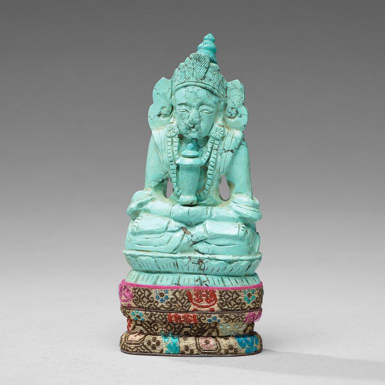 A turquoise figure of a bodhisattva, Tibet, late 19th Century.