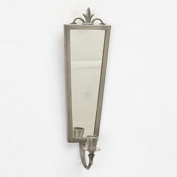 A mirror and pair of wall sconces, Sweden, 1932.