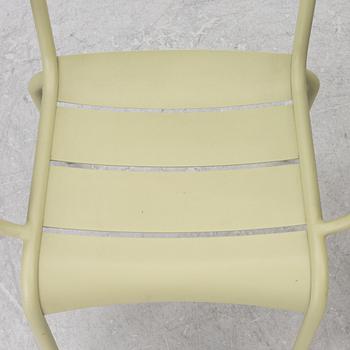 Frédéric Sofia, a table and two chairs for outdoor use, "Luxembourg" Fermob, France, 21st century.