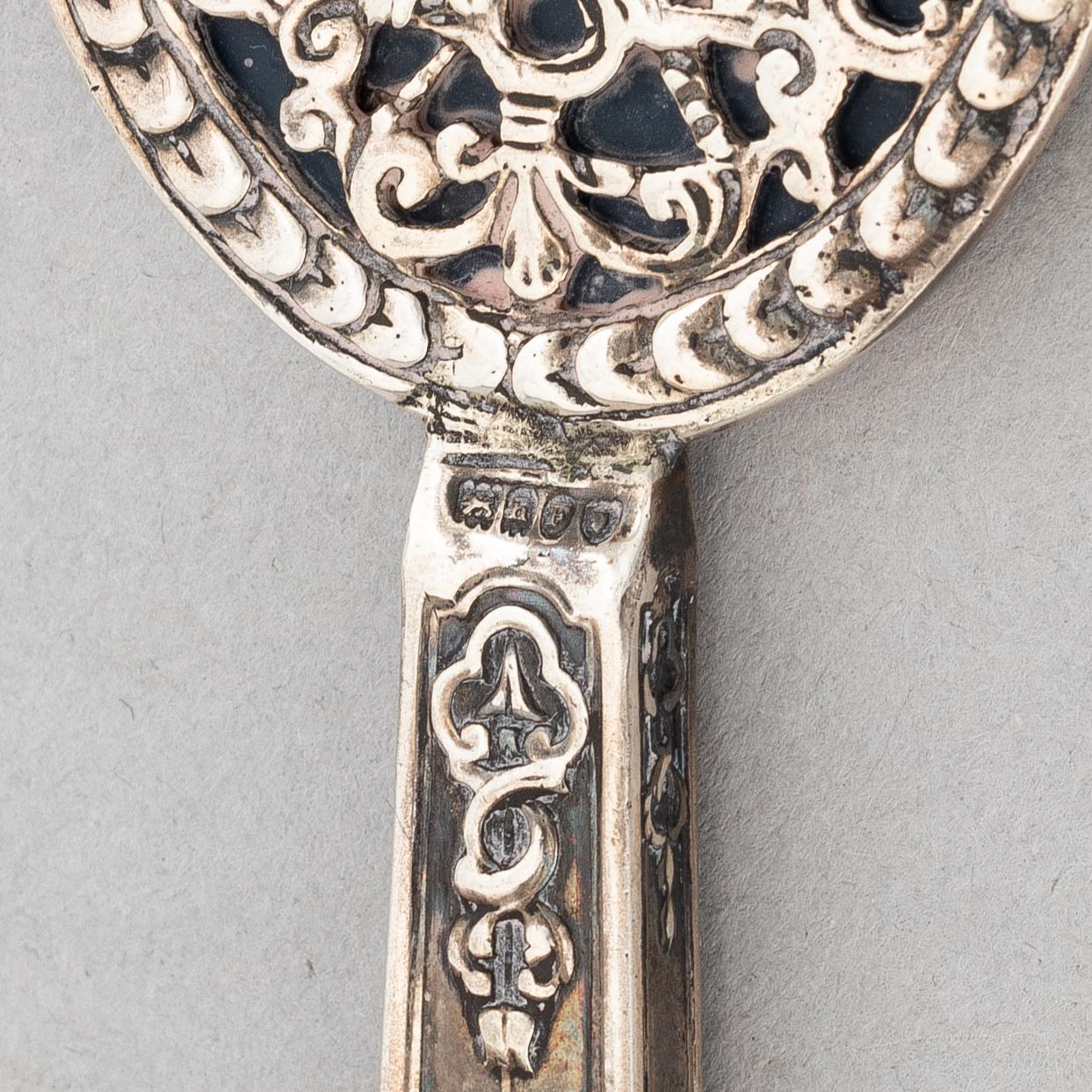Goblet on foot, hand mirror, and box, silver.
